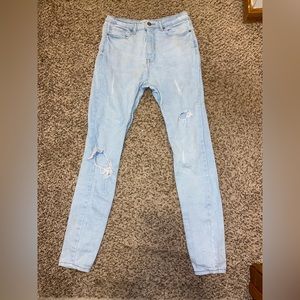 Light blue denim ripped jeans
